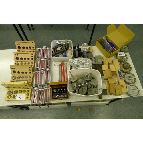 493 - A quantity of various items including boxed weight sets, Salter hanging scales, springs, slotted wei... 