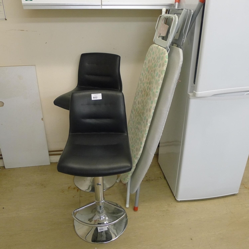 602 - 2 adjustable teachers stools and two ironing boards