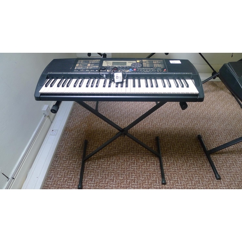 643 - A Yamaha PSR-225 touch response electric keyboard with stand & charger