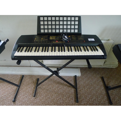 652 - A Yamaha PSR-225 touch response electric keyboard with stand & charger