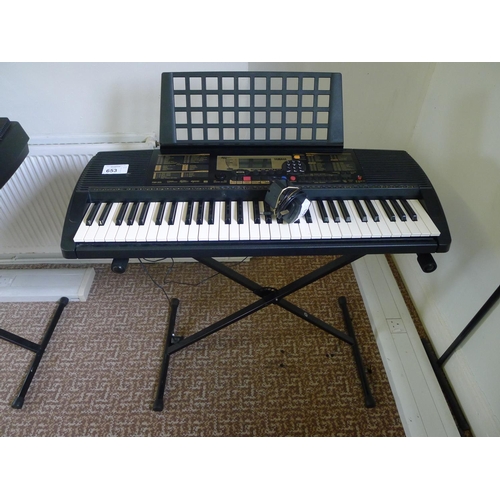 653 - A Yamaha PSR-225 touch response electric keyboard with stand & charger