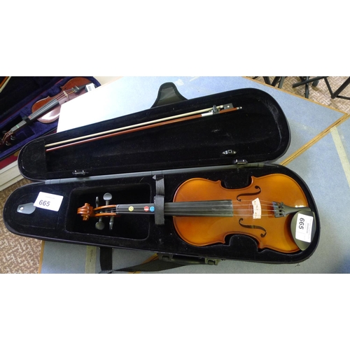 665 - A violin, bow and carry case