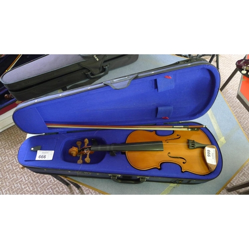 666 - A violin, bow and carry case