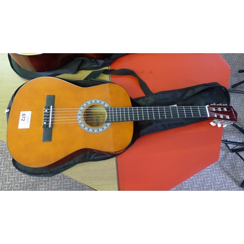 672 - A 6 string acoustic guitar