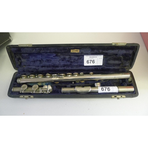 676 - A Romiley flute with carry case