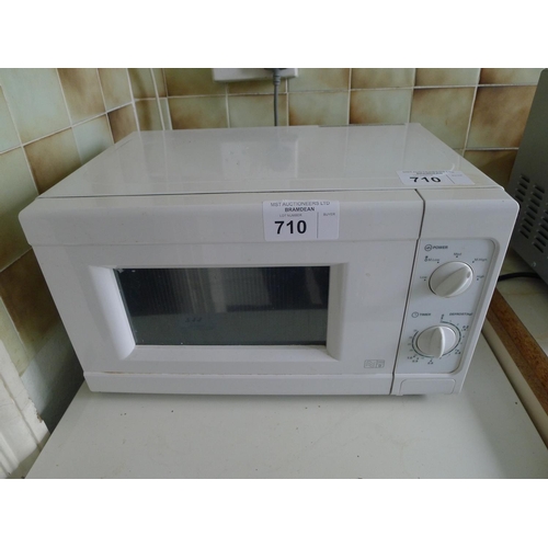 710 - A small microwave oven (no make visible)