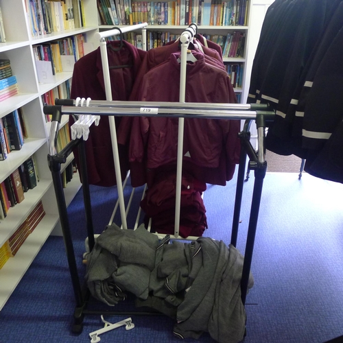 719 - A quantity of Maroon blazers, jumpers and grey jumpers etc including 3 hanging rails