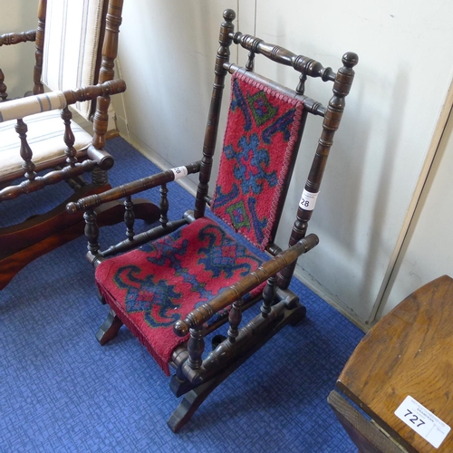 728 - An Edwardian turned Rail child's rocking chair with upholstered seat and back