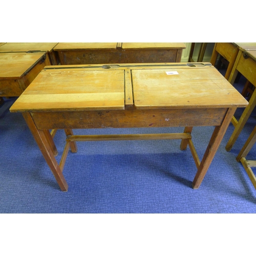 746 - A vintage wooden double classroom desk with lift lids