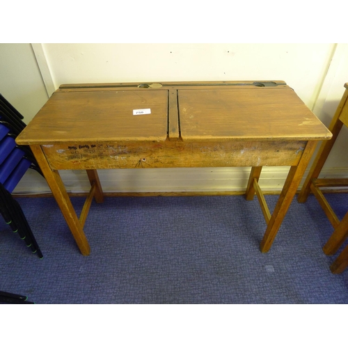 750 - A vintage wooden double classroom desk with lift lids