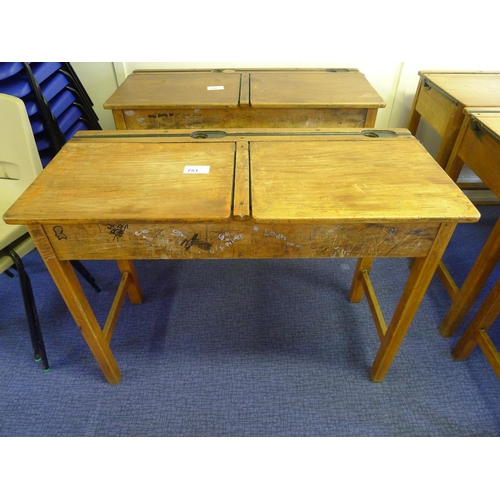 751 - A vintage wooden double classroom desk with lift lids