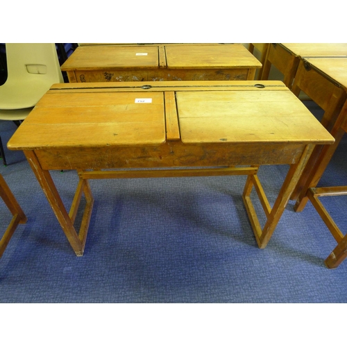 752 - A vintage wooden double classroom desk with lift lids