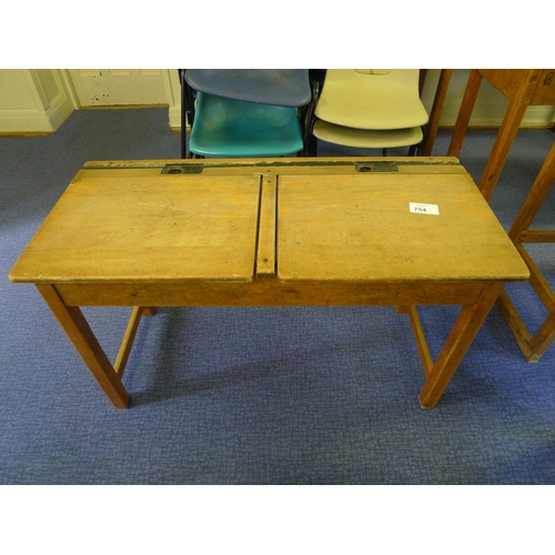 754 - A vintage wooden double classroom desk with lift lids