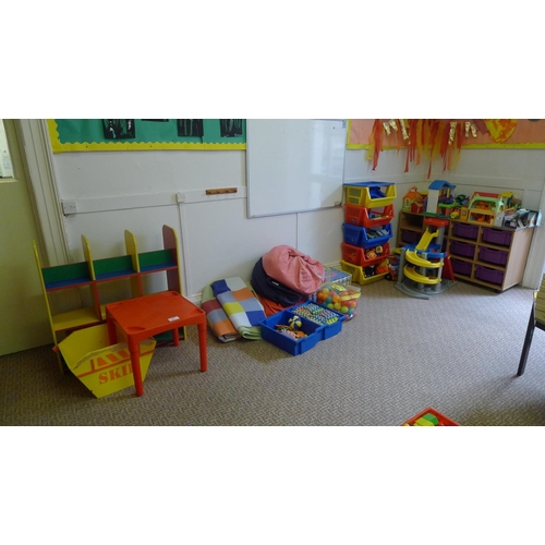 767 - A toy garage, quantity of large plastic kindergarten toys, quantity of jigsaw mats and various shelv... 