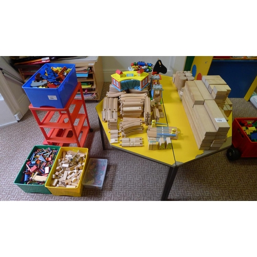 769 - A quantity of wooden track and wooden cars, a quantity of wooden building blocks and animals etc. an... 