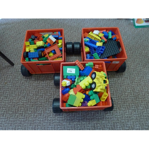 770 - Three trolley boxes containing a quantity of duplo