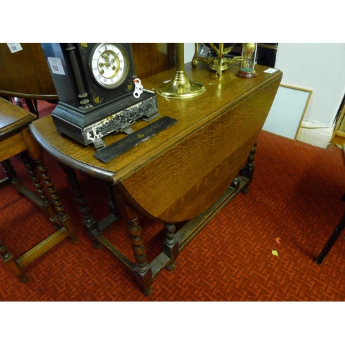 776 - An oak oval topped gateleg table with twisted legs