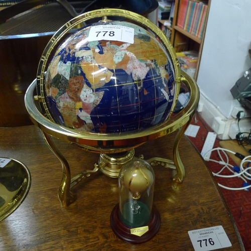 778 - A decorative brass and enamel globe of the world and decorative hot air balloon ornament