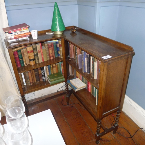 825 - An oak open fronted corner bookcase on Twisted legs (books not included)