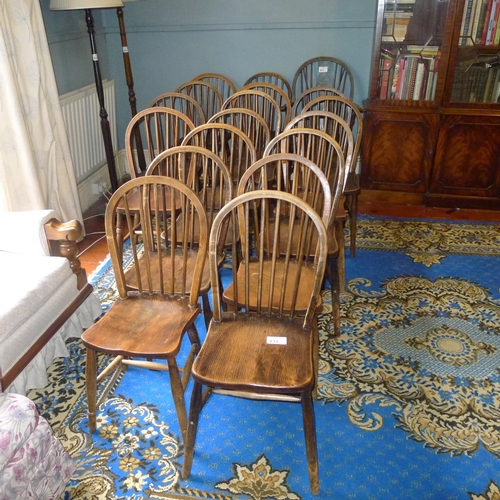 831 - 18 Windsor rail back kitchen chairs with wooden seats