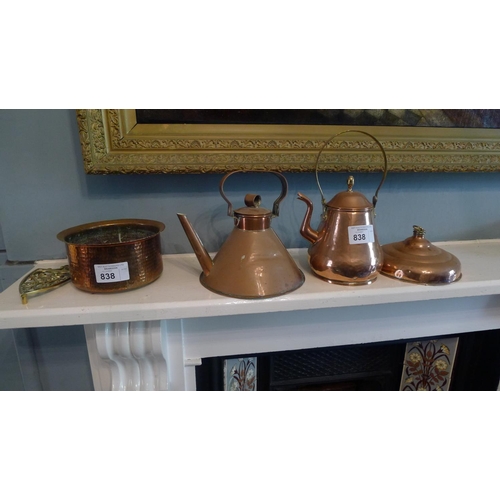 838 - 2 copper kettles, a copper hot water bottle, a copper jardiniere and a brass stand