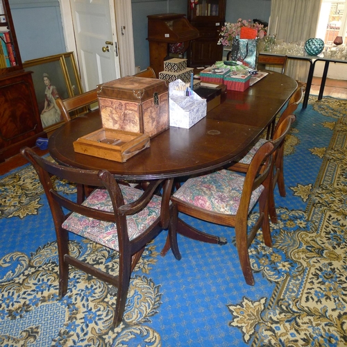 841 - A reproduction mahogany twin pedestal dining table with centre Leaf and a set of 6 matching dining c... 