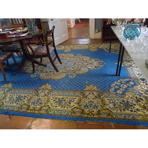 843 - A large blue ground double medallion carpet approximately 670cm x 280cm