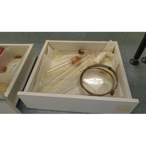 489 - 8 white trays containing a quantity of various laboratory glassware