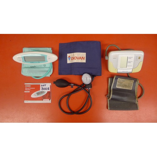 300E - A Lloyds Pharmacy fully automatic blood pressure monitor, a Diovan blood pressure gauge and a Boso-M... 