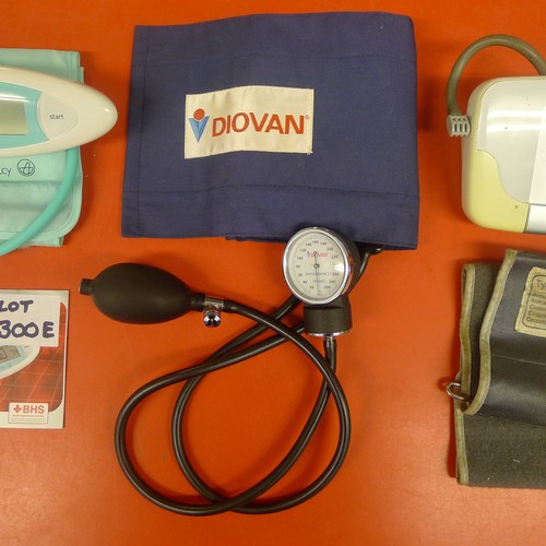 300E - A Lloyds Pharmacy fully automatic blood pressure monitor, a Diovan blood pressure gauge and a Boso-M... 