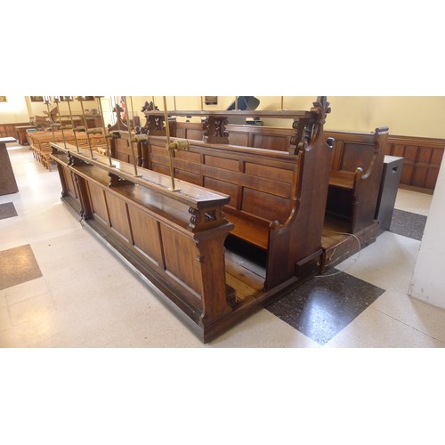 394 - A range of oak ecclesiastical choir stalls in 3 rows, with wooden seats and lectern backs, brass ele... 