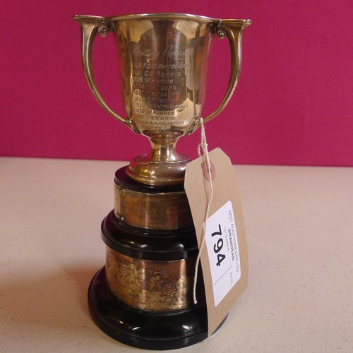 794 - A silver trophy cup 10 cms tall, approximately 103gms,with 2 small stands