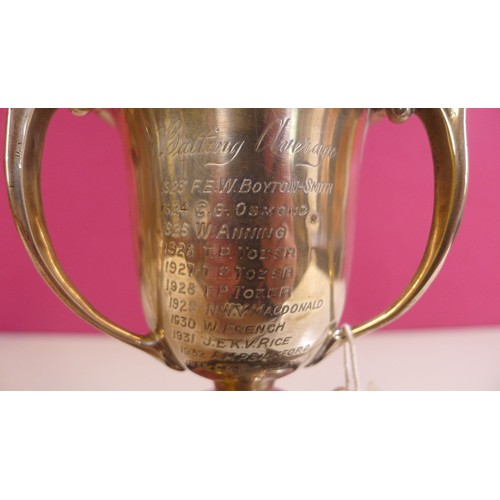 794 - A silver trophy cup 10 cms tall, approximately 103gms,with 2 small stands