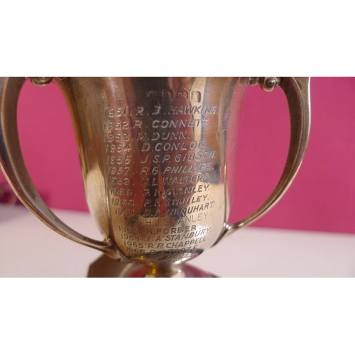 794 - A silver trophy cup 10 cms tall, approximately 103gms,with 2 small stands