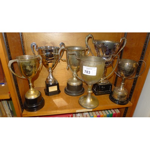 783 - 6 silver-plated and other trophy cups - Contents of 1 shelf