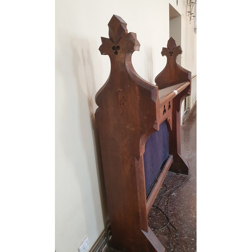 343 - An oak carved ecclesiastical display stand. 120cm wide, 150cm high, 37cm deep.