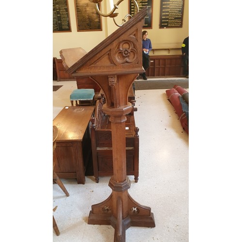 418 - A carved oak ecclesiastical style lectern with brass candle holders 156cm high, approx 60cm x 60cm s... 