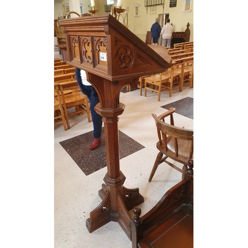 418 - A carved oak ecclesiastical style lectern with brass candle holders 156cm high, approx 60cm x 60cm s... 