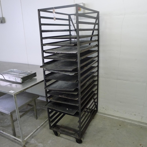 112 - 1 metal wheeled bakers rack containing a quantity of metal trays