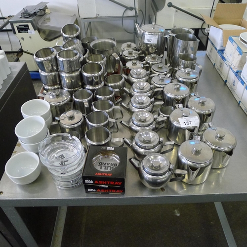 157 - A quantity of various stainless steel tea pots, milk jugs, water jugs, sugar bowls and several glass... 