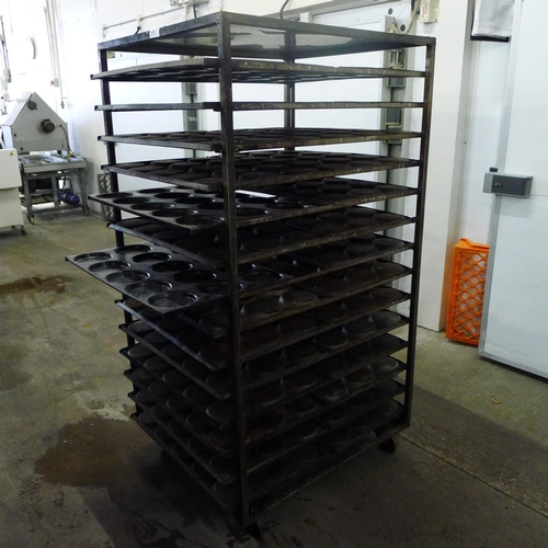 175 - 1 metal wheeled bakers rack containing a quantity of metal trays