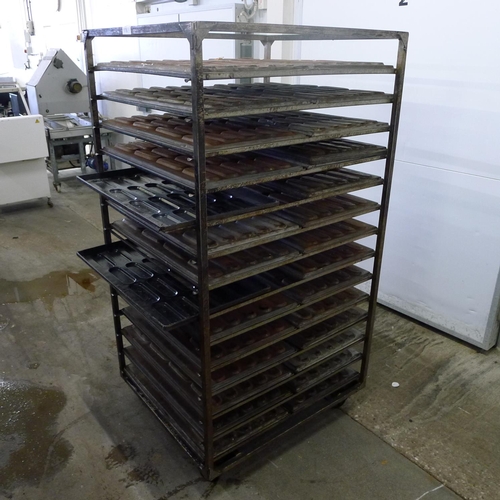 176 - 1 metal wheeled bakers rack containing a quantity of metal trays