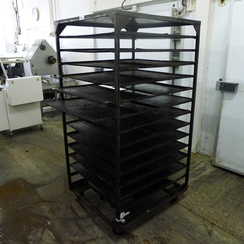 180 - 1 metal wheeled bakers rack containing a quantity of metal trays