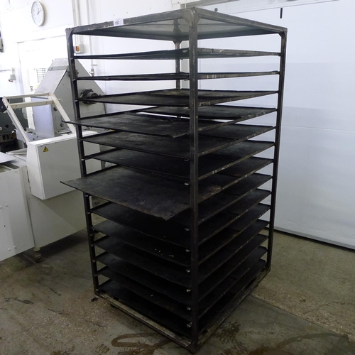 183 - 1 metal wheeled bakers rack containing a quantity of metal trays