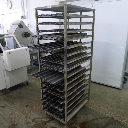 184 - 1 metal wheeled bakers rack containing a quantity of metal trays