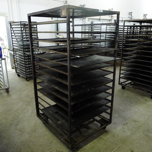 187 - 1 metal wheeled bakers rack containing a quantity of metal trays