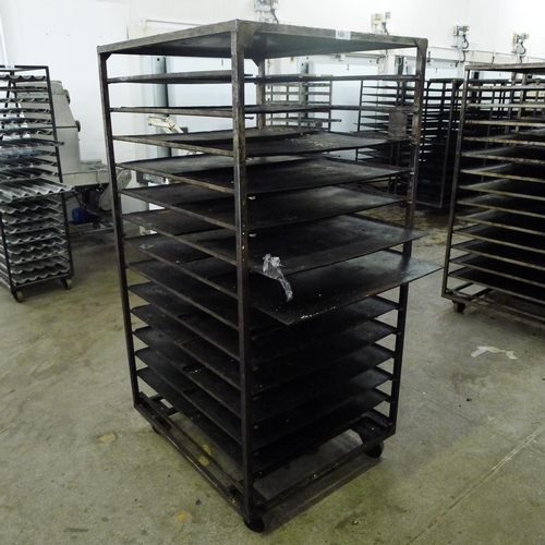 188 - 1 metal wheeled bakers rack containing a quantity of metal trays