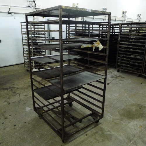 192 - 1 metal wheeled bakers rack containing a small quantity of metal trays