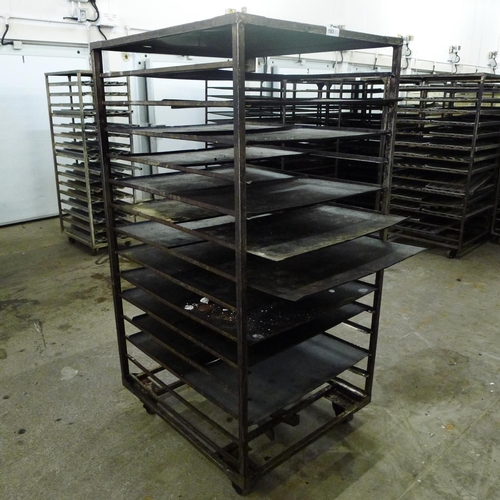 193 - 1 metal wheeled bakers rack containing a quantity of metal trays