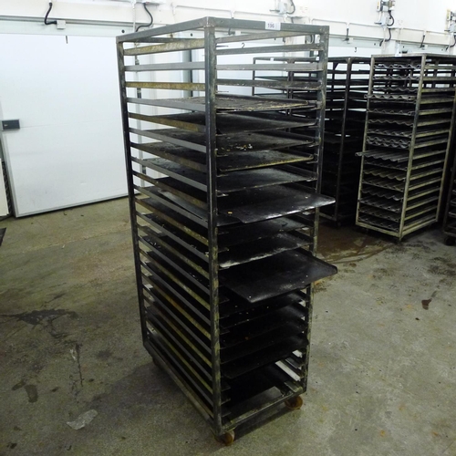 196 - 1 metal wheeled bakers rack containing a quantity of metal trays